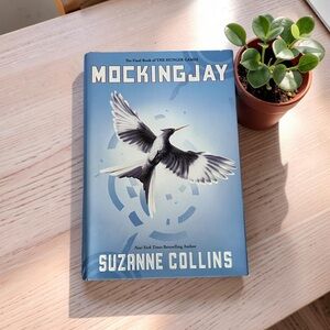 “Mockingjay” by Suzanne Collins - Hunger Games Trilogy